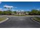 Inviting clubhouse with a covered walkway, complemented by manicured landscaping and palm trees at 3486 Ashwycke St, Mount Pleasant, SC 29466