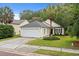 Charming single Gathering home features a two-car garage and well maintained landscaping at 3486 Ashwycke St, Mount Pleasant, SC 29466
