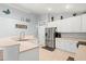 Modern kitchen with white cabinets, stainless steel appliances, and a cozy atmosphere at 3486 Ashwycke St, Mount Pleasant, SC 29466