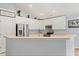 Open kitchen with white cabinets, stainless steel appliances, and ample countertop space at 3486 Ashwycke St, Mount Pleasant, SC 29466