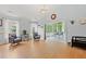 Spacious living room featuring wood floors, large windows, and neutral wall colors at 3486 Ashwycke St, Mount Pleasant, SC 29466