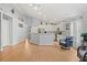 Bright living room with hardwood floors that leads into a kitchen with stainless steel appliances at 3486 Ashwycke St, Mount Pleasant, SC 29466