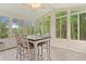 The sunroom is surrounded by large windows that let in plenty of natural light and offer great views at 3486 Ashwycke St, Mount Pleasant, SC 29466