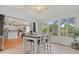 Sunroom with tile flooring, dining table and chairs, and view into house at 3486 Ashwycke St, Mount Pleasant, SC 29466