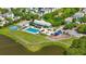 Aerial view of a community pool with a basketball court, playground, and pond in a residential area at 417 Verbena Ave, Summerville, SC 29483