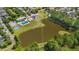 Aerial view of community featuring a pool, playground, and pond at 417 Verbena Ave, Summerville, SC 29483