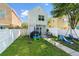 Spacious backyard featuring a white fence, green lawn, and outdoor furniture at 417 Verbena Ave, Summerville, SC 29483