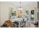 Bright dining room featuring a modern light fixture, table, chairs, and access to the outdoor patio at 417 Verbena Ave, Summerville, SC 29483