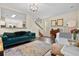 Inviting living room with modern furnishings, hardwood floors, and an open floor plan to the staircase at 417 Verbena Ave, Summerville, SC 29483