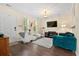 Bright living room featuring stylish decor, hardwood floors, and plenty of natural light at 417 Verbena Ave, Summerville, SC 29483