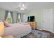Inviting main bedroom features a comfortable bed, dresser, large windows, and ample natural light at 417 Verbena Ave, Summerville, SC 29483