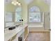 Bright bathroom featuring dual vanities, a garden tub, and a separate shower at 4209 Wildwood Lndg, Charleston, SC 29420