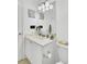 A partial view of a bathroom with a vanity, toilet, and mirror above the sink at 4209 Wildwood Lndg, Charleston, SC 29420