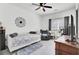 A secondary bedroom that includes a bed, chair, and a large window at 4209 Wildwood Lndg, Charleston, SC 29420