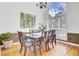 Elegant dining room with a large window and hardwood flooring at 4209 Wildwood Lndg, Charleston, SC 29420