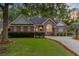 Beautiful brick home with manicured lawn and driveway, exuding classic elegance and curb appeal at 4209 Wildwood Lndg, Charleston, SC 29420
