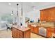 Inviting kitchen with a center island, granite countertops, stainless appliances, and adjacent dining area at 4209 Wildwood Lndg, Charleston, SC 29420