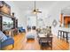 Open-concept living room featuring hardwood floors, a comfortable seating area, and views into the kitchen at 4209 Wildwood Lndg, Charleston, SC 29420