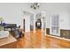 Open-concept living room featuring hardwood floors and stylish architectural details at 4209 Wildwood Lndg, Charleston, SC 29420