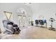 Spacious living room with arched windows, a massage chair, and an exercise bike at 4209 Wildwood Lndg, Charleston, SC 29420