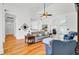 Bright living room featuring hardwood floors, neutral decor, and a ceiling fan for comfortable living at 4209 Wildwood Lndg, Charleston, SC 29420