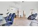 Expansive living room with neutral tile flooring, a massage chair, and open access to other living areas at 4209 Wildwood Lndg, Charleston, SC 29420