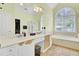 Large bathroom with double sinks, walk-in shower, and soaking tub at 4209 Wildwood Lndg, Charleston, SC 29420