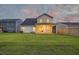 A spacious backyard features a lush green lawn and a well-maintained two-story home at 4374 Cotton Flat Rd, Summerville, SC 29485