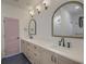 Bathroom boasts double sinks, sleek quartz countertops, and modern matte black faucets at 4374 Cotton Flat Rd, Summerville, SC 29485