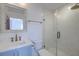 Bathroom featuring blue vanity, white countertop, and glass enclosed shower at 4374 Cotton Flat Rd, Summerville, SC 29485