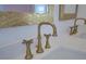 Close up of bathroom featuring bronze faucet fixtures and white countertop at 4374 Cotton Flat Rd, Summerville, SC 29485