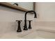 Stylish matte black faucet complements the quartz countertop in the bathroom at 4374 Cotton Flat Rd, Summerville, SC 29485
