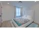 Comfortable bedroom with large window and pastel colored details at 4374 Cotton Flat Rd, Summerville, SC 29485