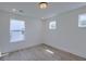Bedroom with large windows allowing natural light and views of neighborhood at 4374 Cotton Flat Rd, Summerville, SC 29485