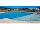 Large community pool with lap lanes, shallow area, and comfortable lounging chairs at 4374 Cotton Flat Rd, Summerville, SC 29485