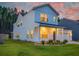 Charming two-story home with lovely landscaping and a covered porch offers curb appeal and a welcoming entrance at 4374 Cotton Flat Rd, Summerville, SC 29485