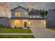Beautiful two-story home with a well-manicured lawn, enhanced by a two-car garage and lush landscaping at 4374 Cotton Flat Rd, Summerville, SC 29485