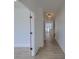 Bright hallway with wood floors, modern lighting, and view into a spacious, light-filled home at 4374 Cotton Flat Rd, Summerville, SC 29485