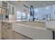 Bright kitchen with a farmhouse sink and stainless steel appliances at 4374 Cotton Flat Rd, Summerville, SC 29485