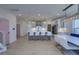 Spacious open-concept with an island, white cabinets, modern appliances, and stylish crystal chandeliers at 4374 Cotton Flat Rd, Summerville, SC 29485