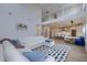Open-concept living area with modern décor, a white sectional, view of staircase and adjacent kitchen at 4374 Cotton Flat Rd, Summerville, SC 29485