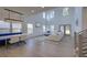 Open-concept living space with high ceilings, stylish furniture, and ample natural light at 4374 Cotton Flat Rd, Summerville, SC 29485