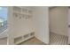 Charming mudroom with white shelving, hooks, and cubbies for storage and organization at 4374 Cotton Flat Rd, Summerville, SC 29485