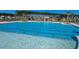 Enjoy the community pool featuring clear blue water, palm trees, and lounge chairs for ultimate relaxation at 4374 Cotton Flat Rd, Summerville, SC 29485