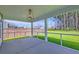 Inviting screened porch perfect for relaxing and enjoying views of the backyard and greenery at 4374 Cotton Flat Rd, Summerville, SC 29485