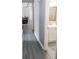 Hallway leading to a bathroom with a white vanity and mirror at 5 Drummond Ct, Charleston, SC 29414