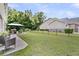 Large backyard with a black metal fence, a gazebo, and well-maintained lawn at 5013 Franconia Dr, Summerville, SC 29485