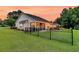 Spacious fenced backyard with a gazebo and screened porch, ideal for relaxation and outdoor activities at 5013 Franconia Dr, Summerville, SC 29485