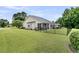 Backyard with a black fence, screened porch, and gazebo, perfect for outdoor enjoyment and privacy at 5013 Franconia Dr, Summerville, SC 29485