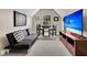 Bonus room features futon, TV, small dining set, and natural light at 5013 Franconia Dr, Summerville, SC 29485